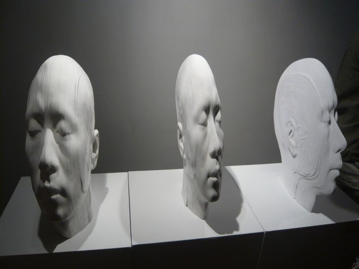 cool paper sculpture of heads, topographic, Chinese contemporary art, distorted heads