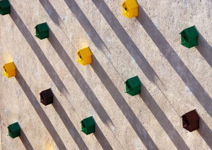 Bird Houses on side of building in Barcelona, Dom Architects, Sparrows come back to nest