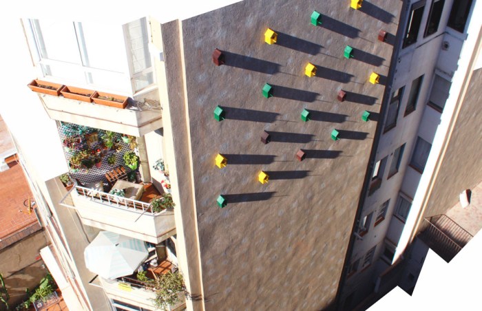 Bird Houses on side of building in Barcelona, Dom Architects, Sparrows come back to nest
