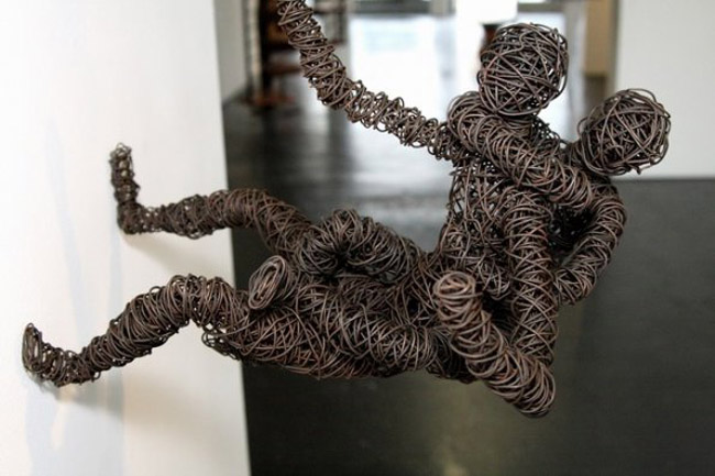contemporary wire sculpture, hanging figures, spiderman-like, Chris Mason