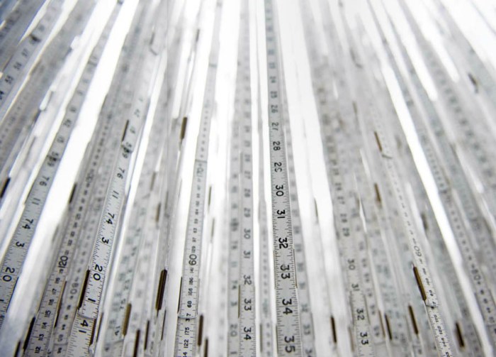 Cool art installation, hanging rulers, wall clocks and vinyl type, interactive art, Brazilian contemporary art, Cildo Meireles