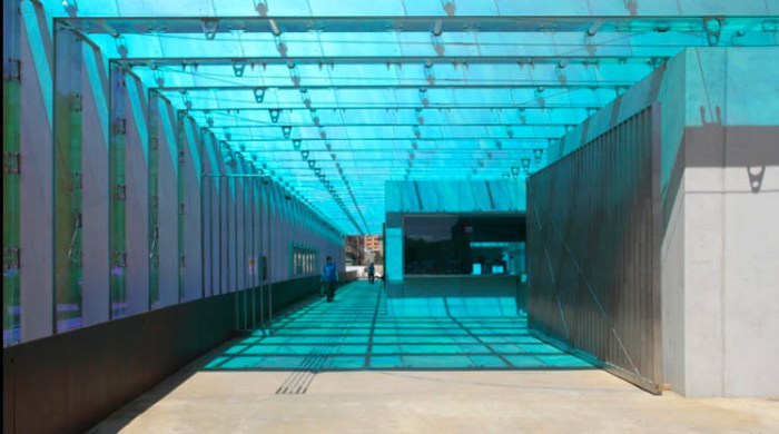 Cool subway/metro station in Spain, colored glass, nicely designed machines and seats, contemporary architecture in Spain, Luis Ferrer