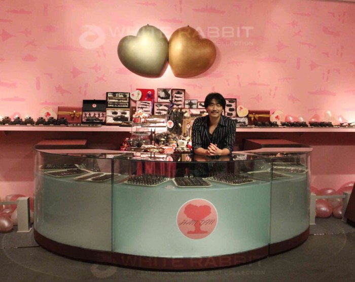 Contemporary Chinese art, Art installation with chocolate arms, grenades, guns, tiny tanks, set up as a chocolate shop