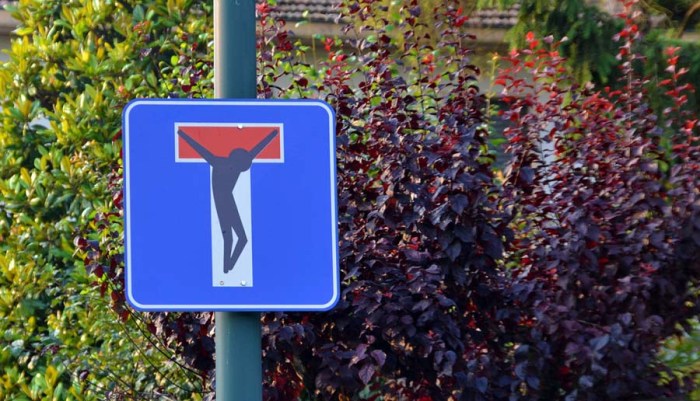 European Street Art, pictorial stickers on street signs, graffiti, humor, Clet Abraham, contemporary art, fun