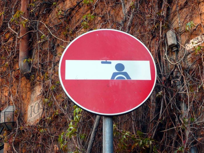 European Street Art, pictorial stickers on street signs, graffiti, humor, Clet Abraham, contemporary art, fun