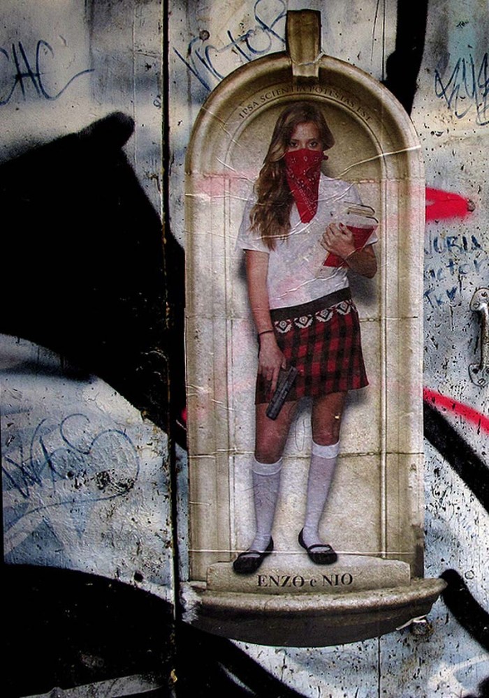 Enzo and Nio, New York Street Artists, saintly school Girls with guns and ammunition, wheat pastings.