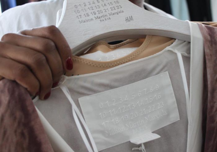 Avant Garde Fashion, Trompe l'oeil design, Martin Margiela candy wrapper clutch, fishnet leggings, keyring necklace, belt jacket, H&M