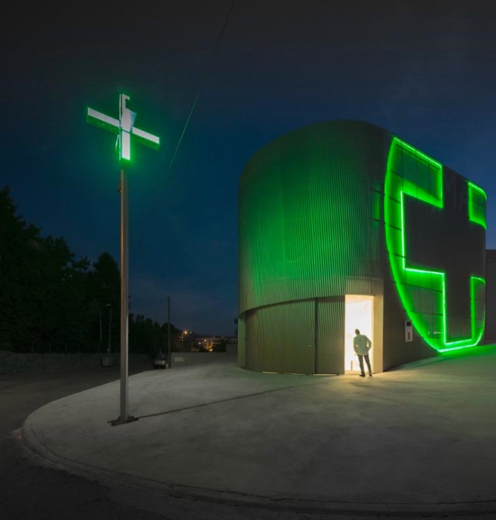 Very cool pharmacy in Portugal with neon sign incorporated into facade, farmacia lordelo in Vila Real, Portugal by Jose Carlos Cruz, Arquitecto