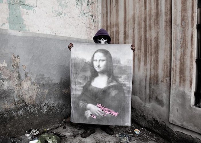 Urban_Maeztro Honduras Street Art Iconic Paintings wheatpasted with arms, Firing back against violence with street art, collabcubed