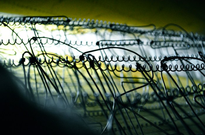 Cool light installation by Jad k. Melki, mattress, lights, springs and wires shaped as type