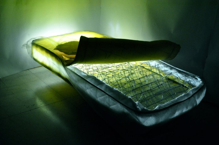 Cool light installation by Jad k. Melki, mattress, lights, springs and wires shaped as type