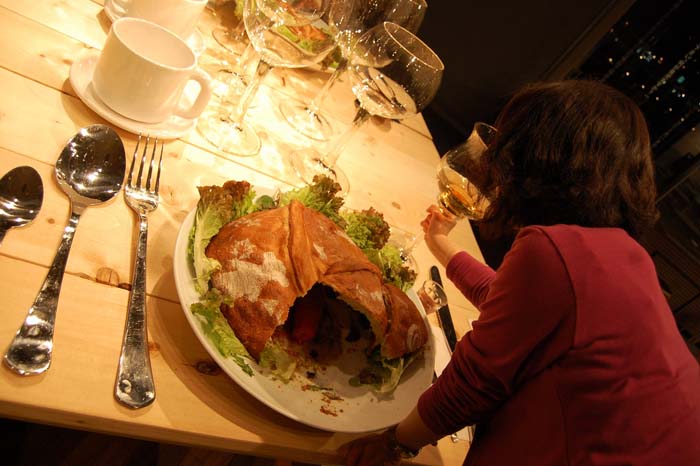 Giant everday objects as art, self-mocking. Giant dinner table, chairs and tablesetting, Gulliver's Dinner, contemporary humorous art