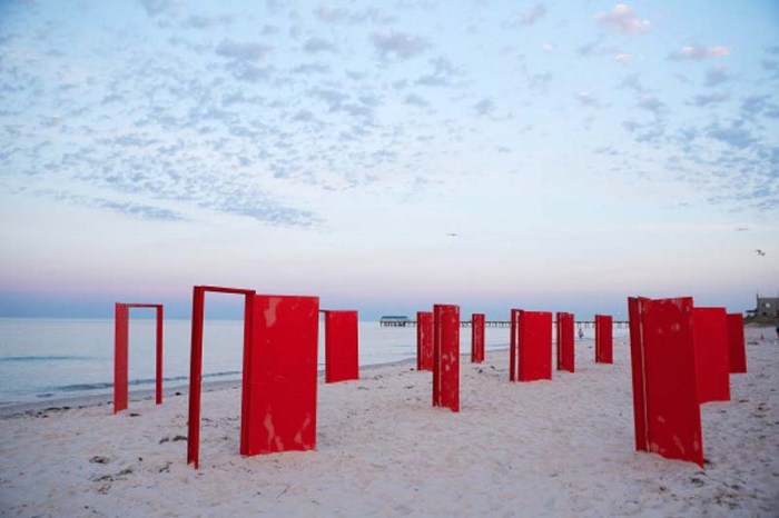 ADELAIDE, SA - DECEMBER 13:  Red doors stand on the beach before being used in an installation by surrealist artist, Andrew Baines at Henley Beach on December 13, 2012 in Adelaide, Australia. The installation was called 'Doorways To Potential'.  (Photo by Morne De Klerk/Getty Images)