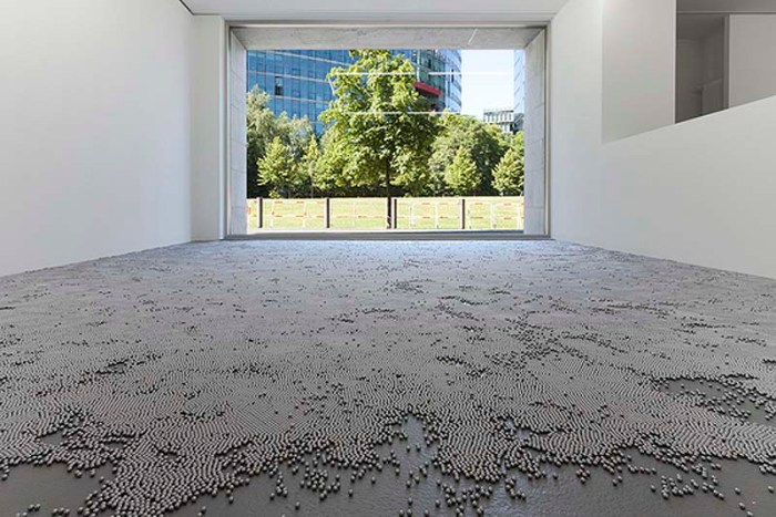 robert Barta, installation art, crossing half a million stars, half a million metal balls on floor of gallery to walk over carefully