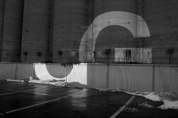 Letters at Large by Audra Hubbell, Large projections of letters with cool effects against architecture. Photographs. Typography