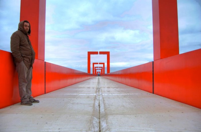 The red gateway pedestrian bridge, Cergy-Pontoise, France, designed by Dani Karavan. Cool red bridge